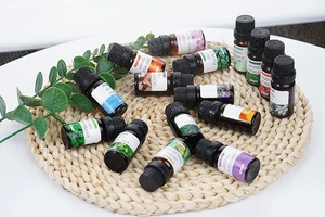 Collection of 15 essential oils like Lavender and Peppermint on a woven mat