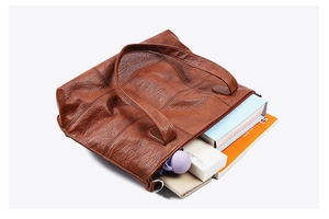 Detailed interior view of vintage brown tote bag showing its large storage capacity
