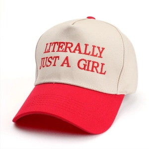 Detail of embroidered 'LITERALLY JUST A GIRL' text on a two-tone baseball cap