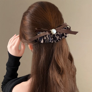 Maillard leopard print bow hair clip with white pearl detail for women hairstyles