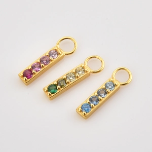 Three gold s925 silver pendants with colorful gradient zircon stones on white background