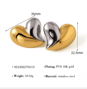Detailed view of two-tone stainless steel heart earrings with 18K gold PVD plating