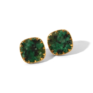 Macro detail of square green turquoise stones in gold stainless steel earrings setting