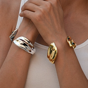 Irregular organic liquid metal open bracelet with polished gold and silver finishes