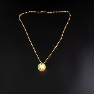 Close-up of a 70s retro disco ball necklace with a glowing iridescent crystal pendant