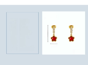 Détail des boucles d'oreilles étoile dorées 18K avec zircon rouge et perles blanches