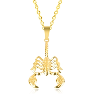 Detail of a 18K gold-plated stainless steel scorpion pendant with polished metal texture