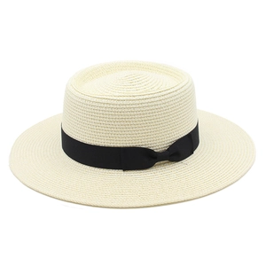 Classic beige straw boater hat with a wide black ribbon band and elegant side bow