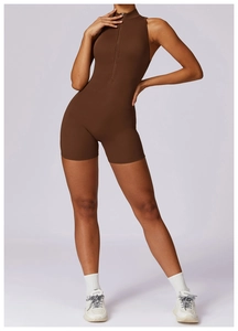 Close-up of high-stretch brown yoga bodysuit featuring front zipper and stand collar