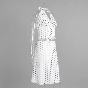 Detailed view of polka dot two-piece set featuring a halter top and A-line midi skirt