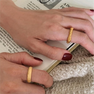 Detailed view of 925 silver knotted rings with spiral and frosted sandblast textures