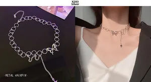 Detailed close-up of a silver butterfly choker with a hanging star tassel on a chain necklace