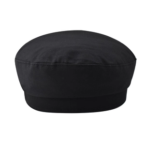 Detailed view of black cotton twill newsboy cap with classic curved structure and stitching