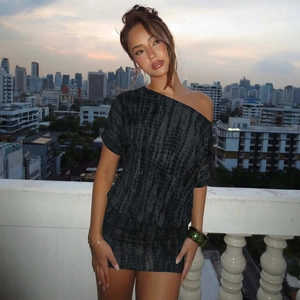 Detail of black tie-dye bodycon dress with hollow out back and stylish side cut-out