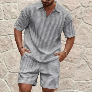Men's grey waffle knit two-piece set featuring short sleeve zipper polo and shorts