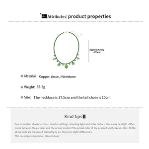 Detail view of a green beaded necklace with five heart-shaped zircon pendants and sizing