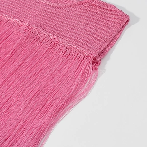 Macro shot of hot pink knit dress detailing with silk-like fringe and texture
