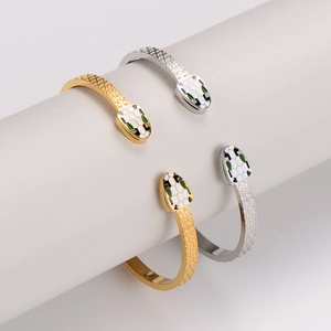 Serpent head open bangle with hexagonal scale pattern in gold and silver finish