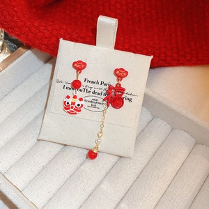 Asymmetric Chinese New Year lion dance earrings with Rich and Fu characters and red tassels
