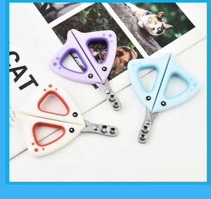 Three colorful pet nail clippers with cat-ear handles and stainless steel blades detail