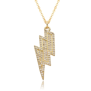 Detailed close-up of a gold lightning bolt pendant necklace with sparkling zircons