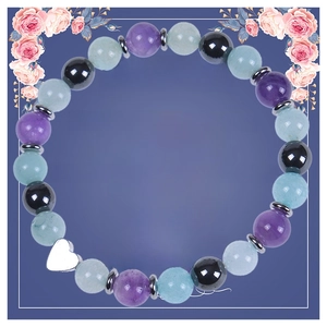 Close-up of Soul Sister natural stone bead bracelet with silver heart pendant on gift card