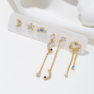 Golden 925 silver stud earrings set with moon star motifs and sparkling zircon tassels