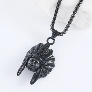 Close-up of a gunmetal vintage Indian chief head pendant on a stainless steel necklace