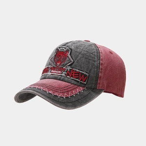 Detail of vintage washed baseball cap with patchwork husky embroidery and contrast stitching