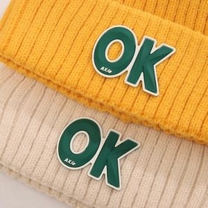 Knitted winter beanies for kids with OK patch and thick warm lining in ginger and beige