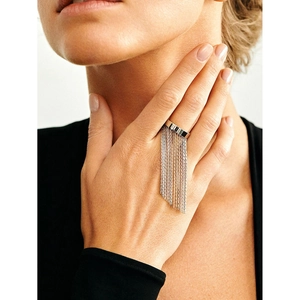 Macro shot of silver stainless steel wide ring featuring long metallic chain tassels