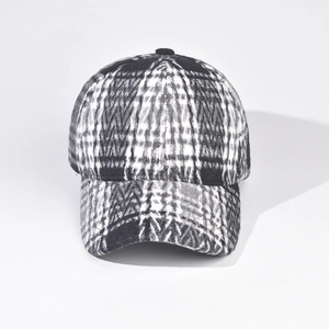 Close-up of black and white checkered baseball cap with thick wool texture for winter