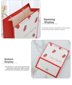 Detail of strawberry print gift bag showing the reinforced bottom and folding structure