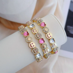 Pink heart and smiling flower bracelets in gold finish with sparkling zircons for women