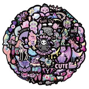 Macro view of creepy cute pastel goth stickers with skulls and grim reaper patterns