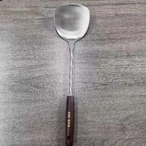 Detail of food-grade 304 stainless steel spatula with vintage dark wood anti-scald handle