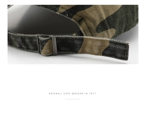 Macro shot of camouflaged cotton baseball cap showing adjustable metal buckle strap
