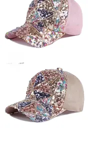 Detail of colorful sequins geometric pattern and mesh on beige and pink baseball caps
