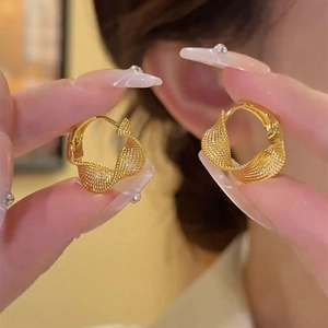 Elegant gold twisted mesh hoop earrings with a modern textured metal design for women