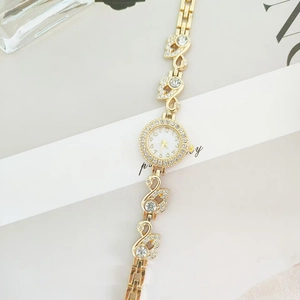 Elegant gold luxury swan bracelet watch for women with sparkling crystal accents