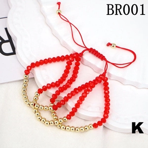 Detailed view of red woven crystal beaded bracelet set with adjustable gold copper beads