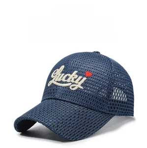 Close-up of breathable navy blue mesh baseball cap with white Lucky embroidery and heart