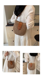 Detail showing brown woven straw shoulder bag with premium leather strap and buckle