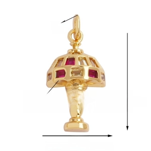 Detail view of vintage gold hollow lamp pendant with red and clear rectangular zircon stones