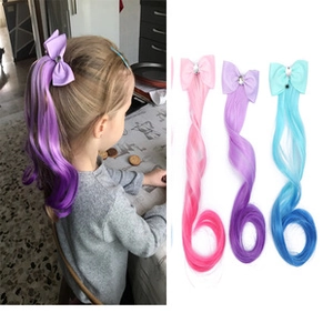 Detail of colorful bow hair extensions with rhinestones for girls' princess hairstyles