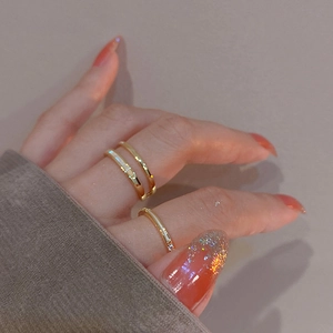 Close-up of gold-plated double-layer ring featuring a mother-of-pearl shell inlay