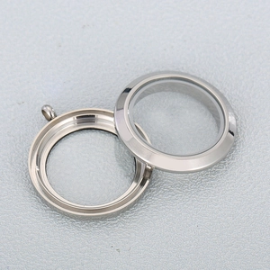 Detail view of round stainless steel locket base with clear window for DIY jewelry