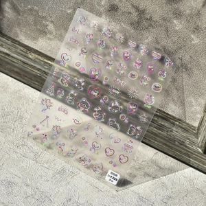 Laser rainbow bear nail stickers with hearts and smileys on transparent base sheet