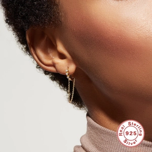 Detailed close-up of S925 sterling silver star hoop earrings with zircon fringe chain