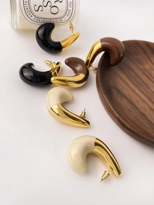 Detail of 18K gold-plated teardrop earrings featuring glossy colorful enamel inlay